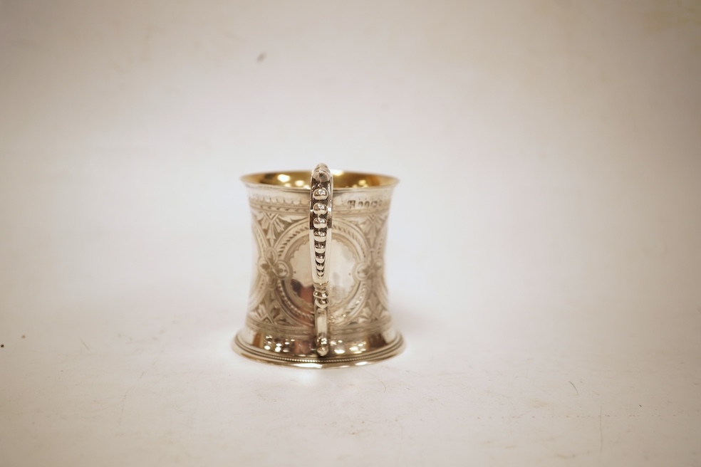 A Victorian bright cut engraved silver christening mug, of waisted form, with engraved inscription and beaded handle, Samuel Roberts & Charles Belk, Sheffield, 1867, 82mm, 5.2oz.
